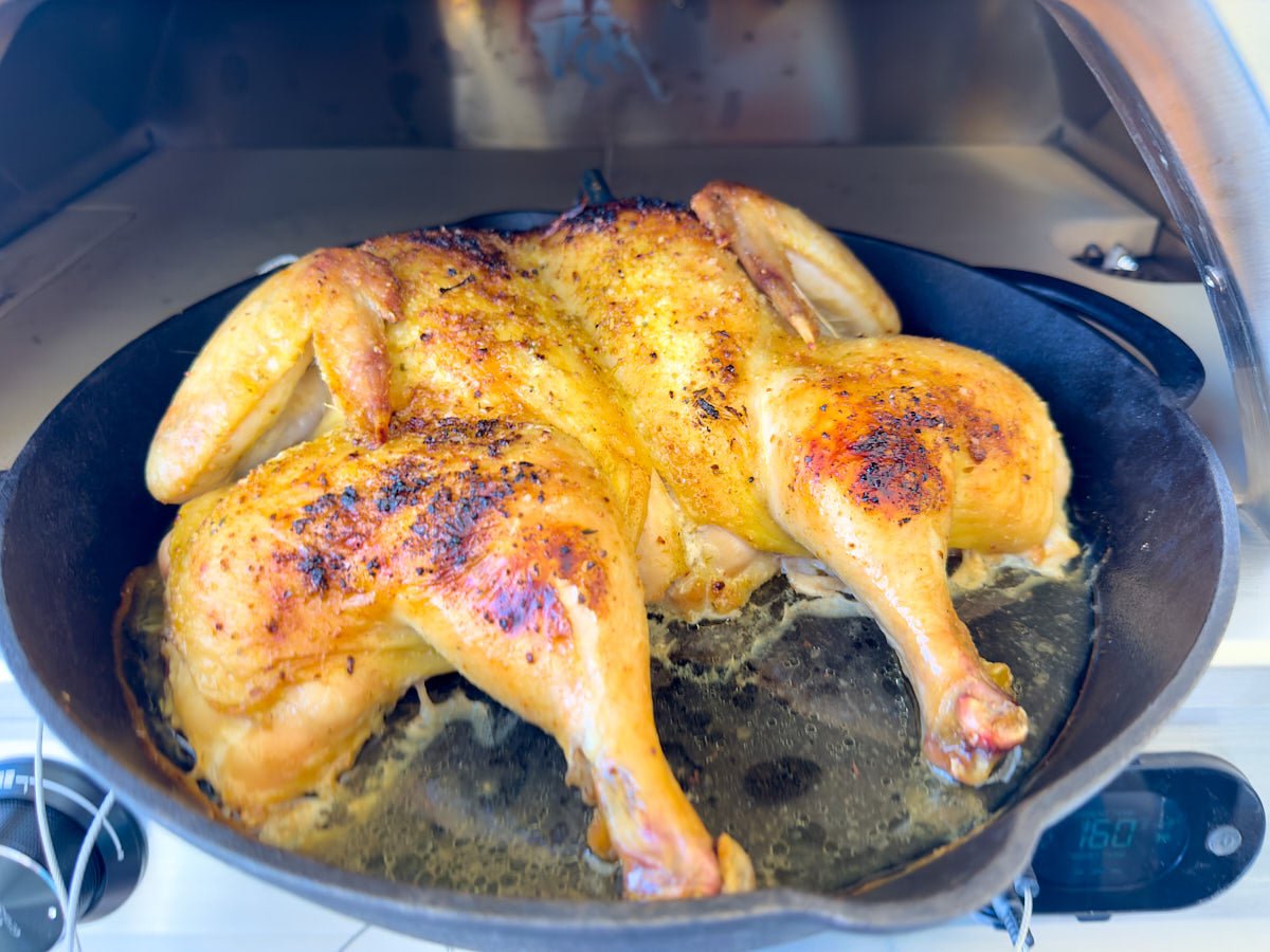 Pizza Oven Spatchcock Chicken with Garlic and Herbs - Kitchen In The Garden