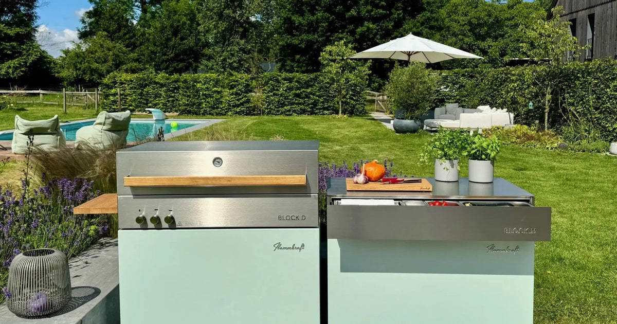 Bespoke outdoor kitchen installation in a Surrey garden, with sintered stone worktops and built-in grill
