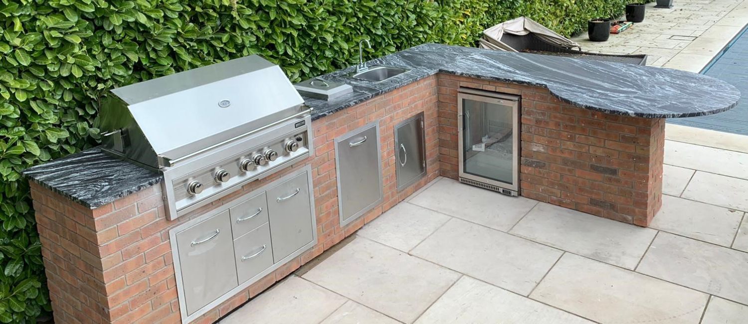 Design an L-shaped outdoor kitchen in your garden