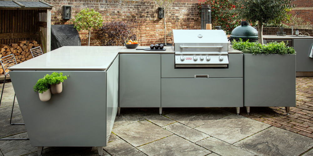 Vlaze L-shaped outdoor kitchen available from Kitchen in the Garden, Surrey