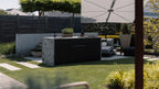 Black Cubic C1 kitchen island with ceramic waterfall ends