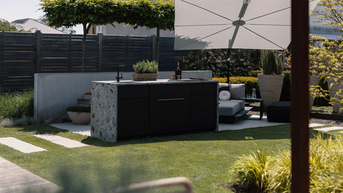 Black Cubic C1 kitchen island with ceramic waterfall ends