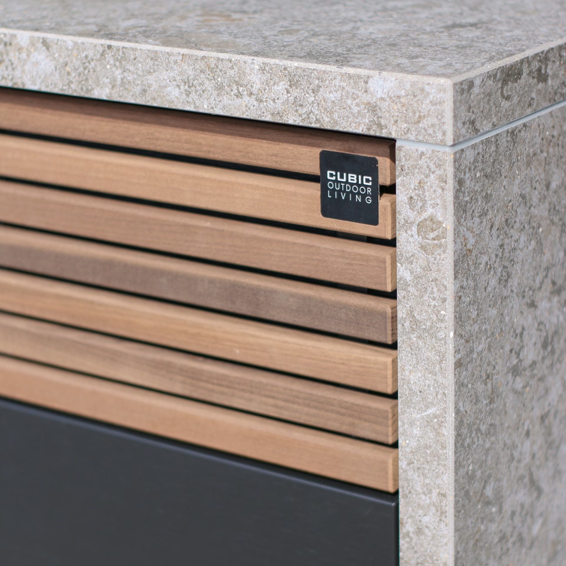 Cubic outdoor kitchen cabinet detail in stone and timber