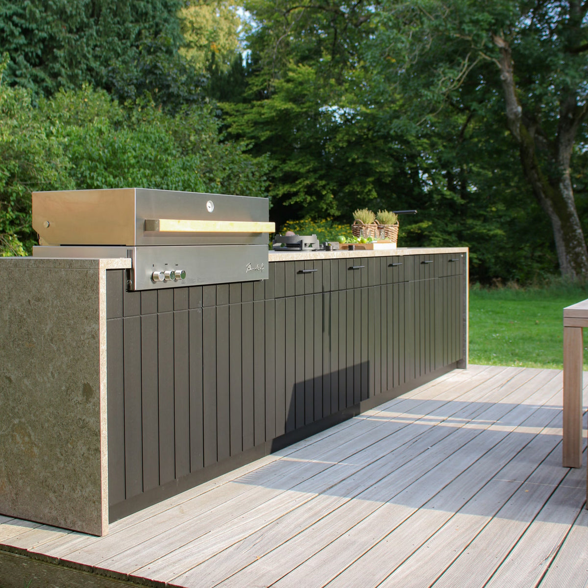 Cubic C4 Quiet Hearth outdoor kitchen in a garden